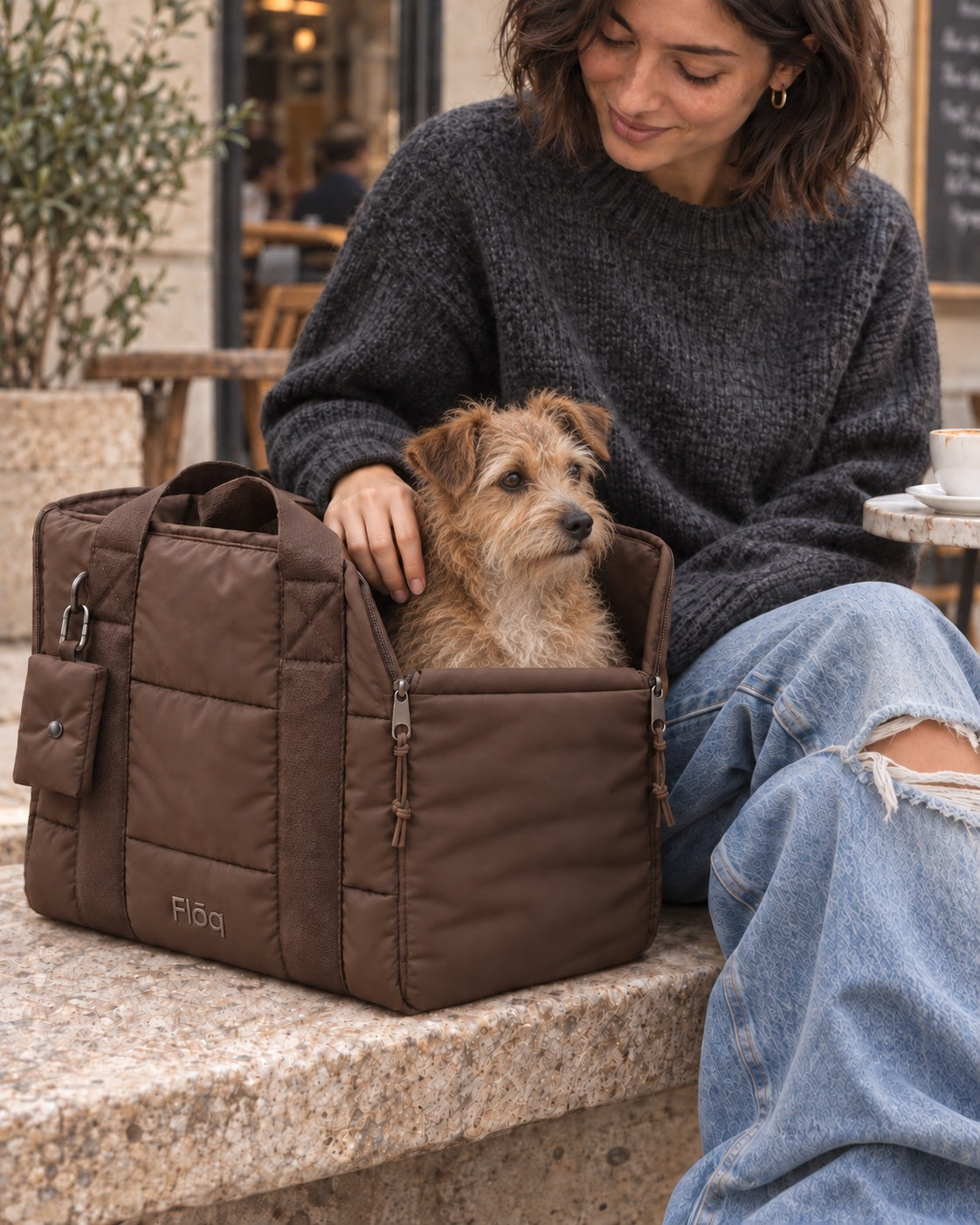 The Mocha Together Carrier with a dog resting inside, in warm natural light